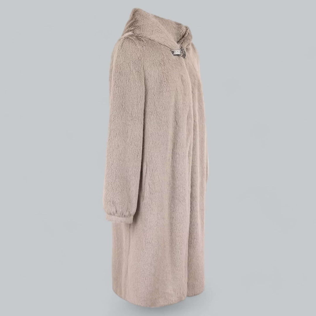 Fashionable women's elegant faux fur long winter coat. Hooded, warm, and luxurious ethical outerwear.