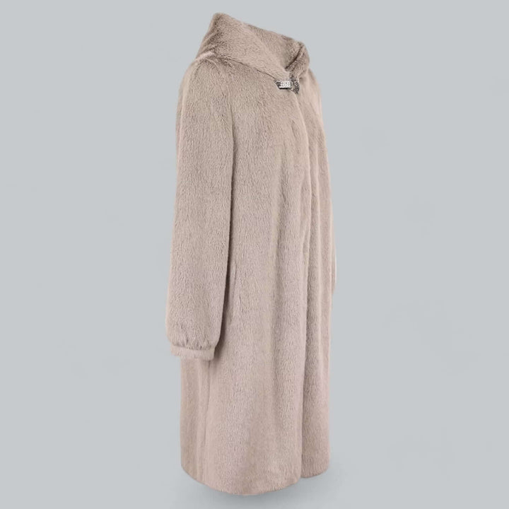 Fashionable women's elegant faux fur long winter coat. Hooded, warm, and luxurious ethical outerwear.