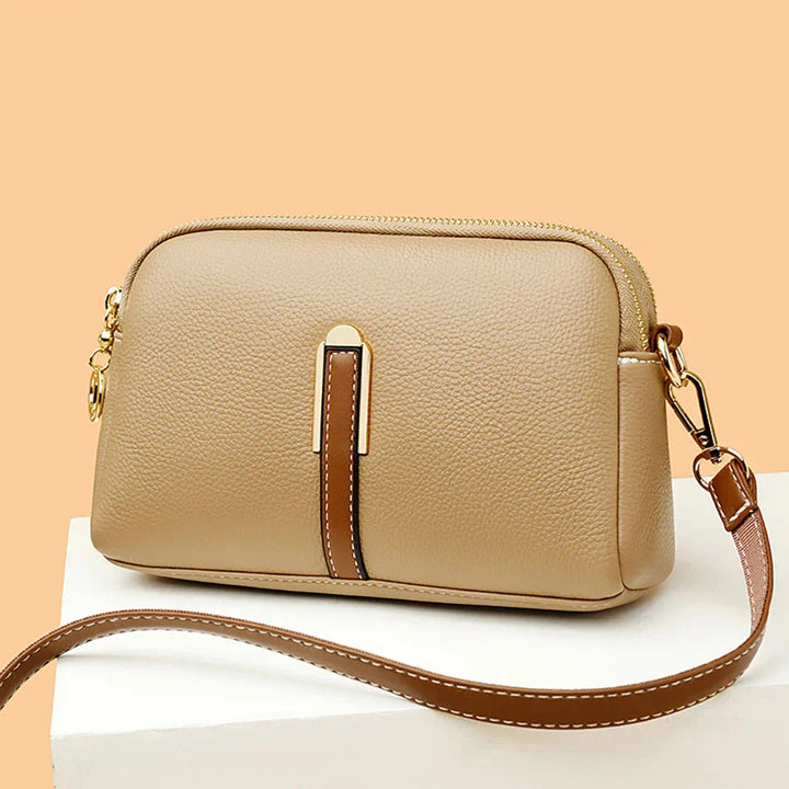 Elegant women's faux leather shoulder bag with a structured design, a versatile daily use accessory.