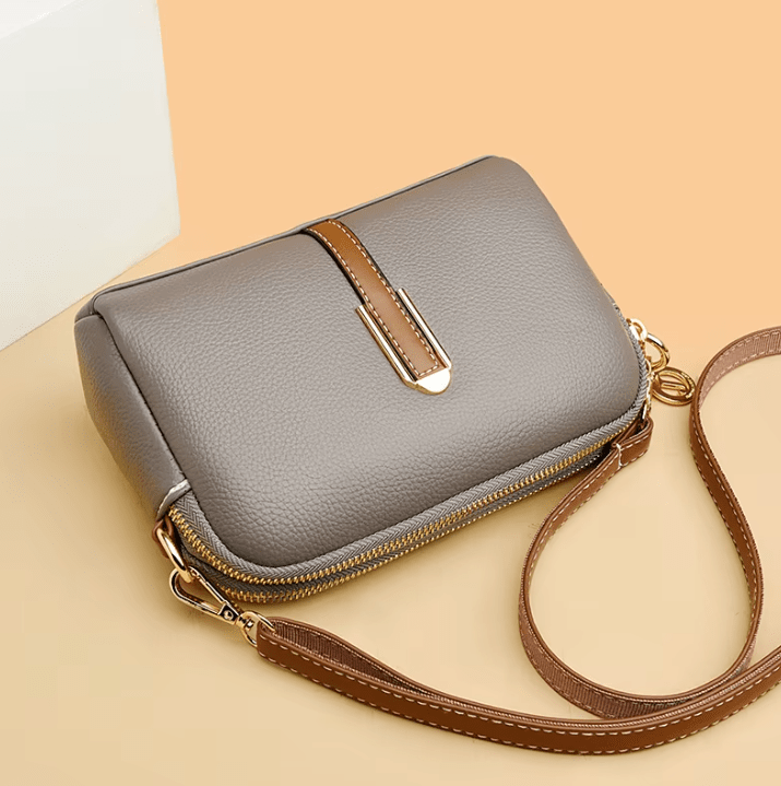 Modern vegan leather shoulder bag, an elegant women's fashion accessory. Also works as a crossbody.
