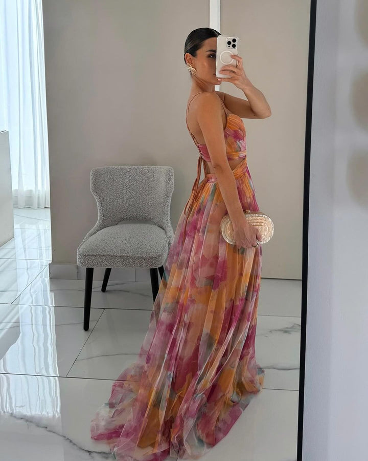 Fashionable women's spaghetti strap printed maxi dress, figure-hugging fit for stylish summer party evenings.