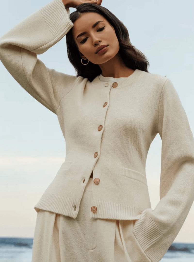 Elegant women's flare sleeve sweater in a soft knit, perfect for fall and winter fashion.