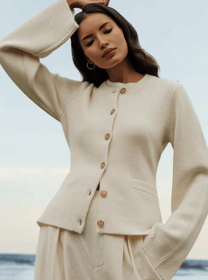 Elegant women's flare sleeve sweater in a soft knit, perfect for fall and winter fashion.