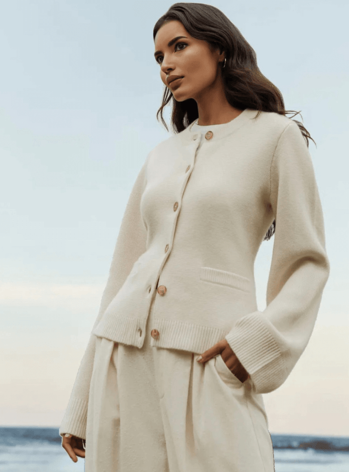 Fashionable women's elegant top featuring unique flare sleeves and comfortable soft knit.