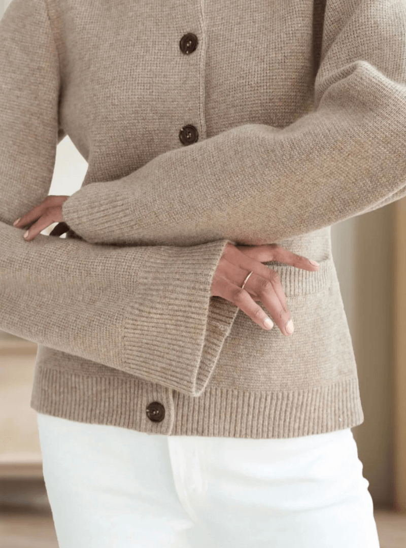 Soft knit women's sweater with elegant flare sleeves, a stylish and cozy addition to any wardrobe.