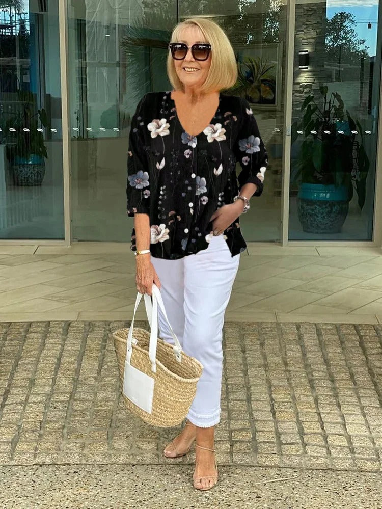 Chic women's floral blouse offering an elegant and feminine style. A comfortable, lightweight top for casual wear.