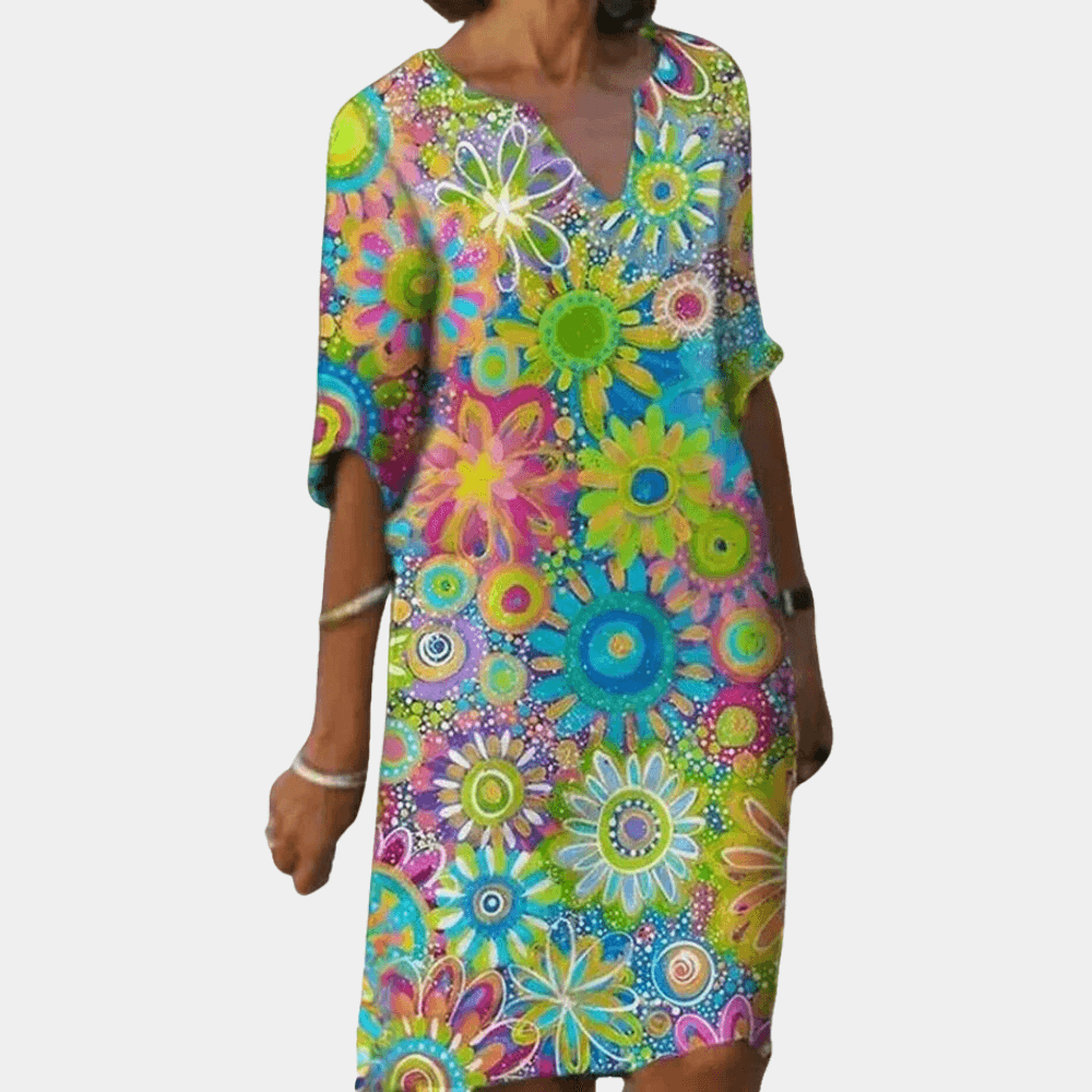 Chic women's floral print midi dress. Vibrant polyester fabric, ideal for elegant casual or party wear.