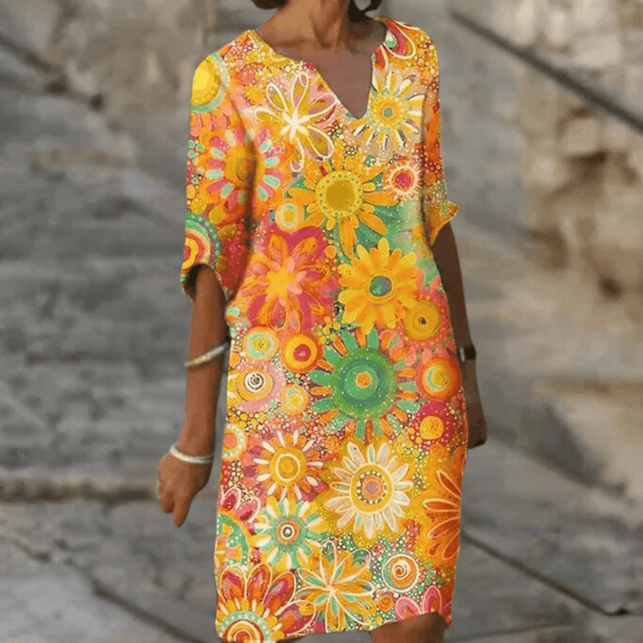 Vibrant floral polyester midi dress for women. Elegant summer party or casual occasion wear.