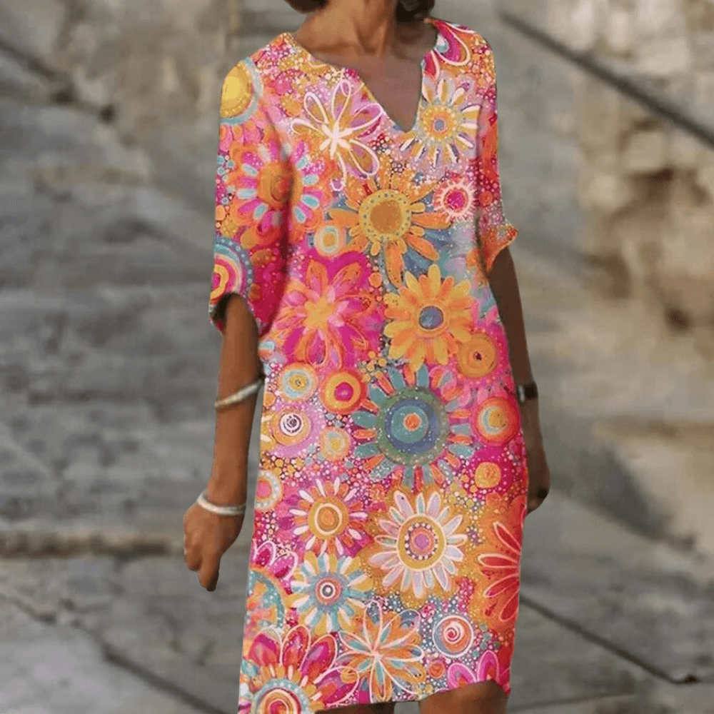 Stylish women's midi floral dress. Elegant and vibrant, perfect polyester dress for summer parties or chic occasions.