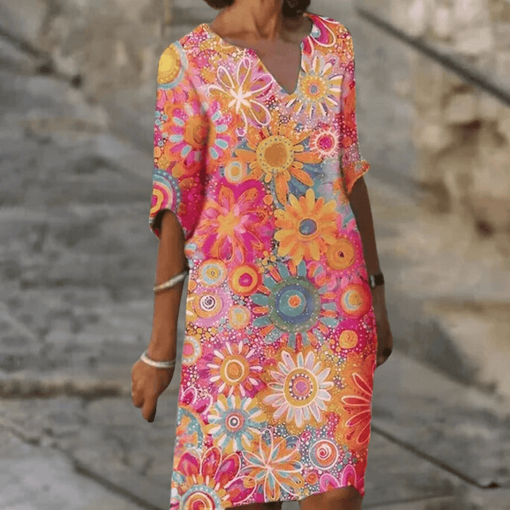 Stylish women's midi floral dress. Elegant and vibrant, perfect polyester dress for summer parties or chic occasions.