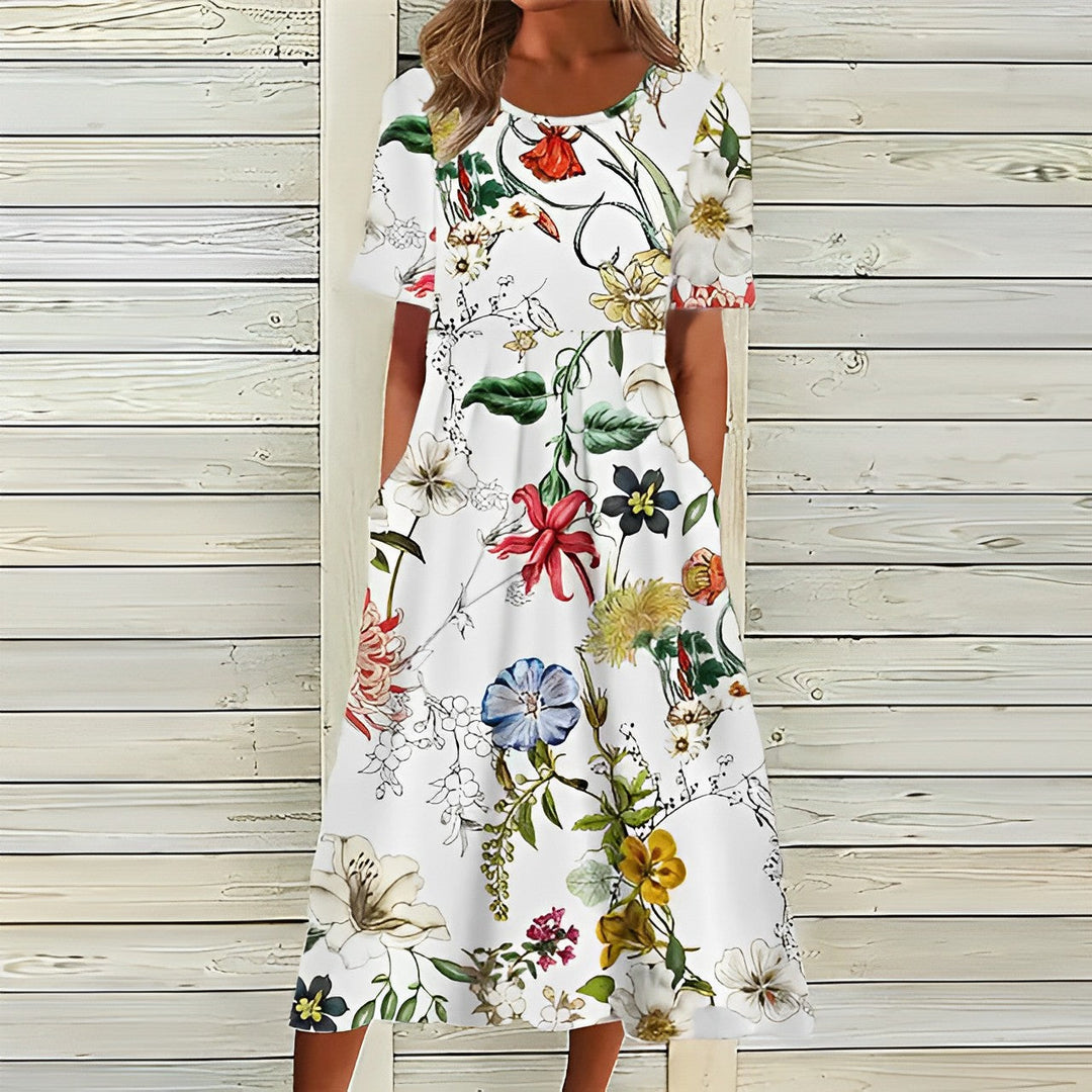 Elegant women's floral midi dress with convenient pockets, short sleeves, & round neck, ideal for summer/spring.