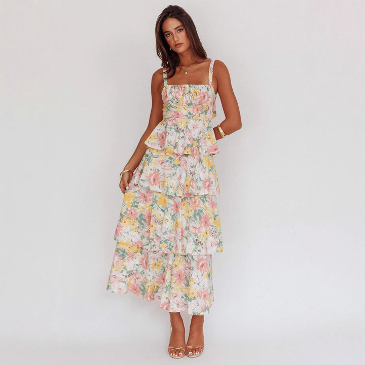 Elegant women's floral midi dress with ruffled hem, perfect for summer parties. Sleeveless cotton blend.