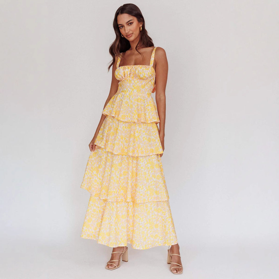 Sleeveless floral midi dress for women with ruffled hem, ideal for spring or summer casual events.