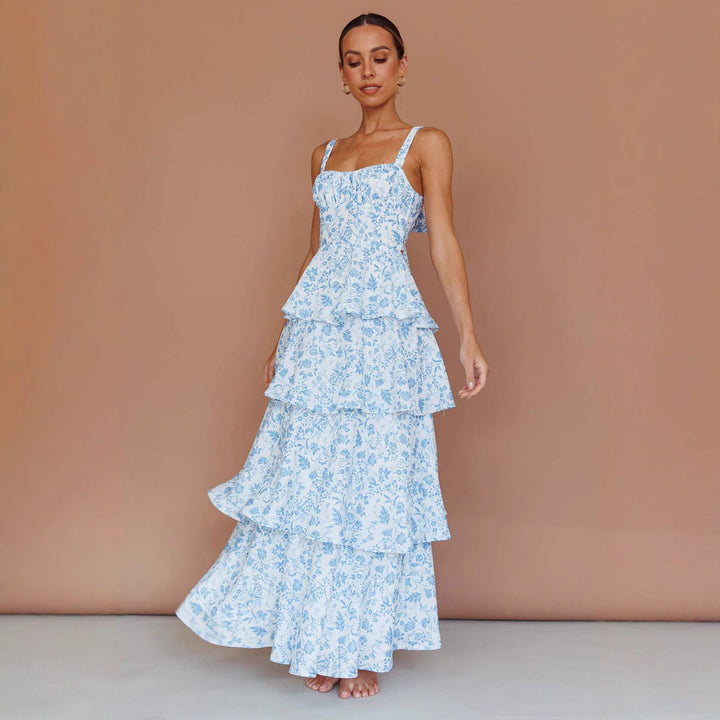 Chic women's floral party midi dress. Elegant ruffled hem and sleeveless design in a cotton blend.