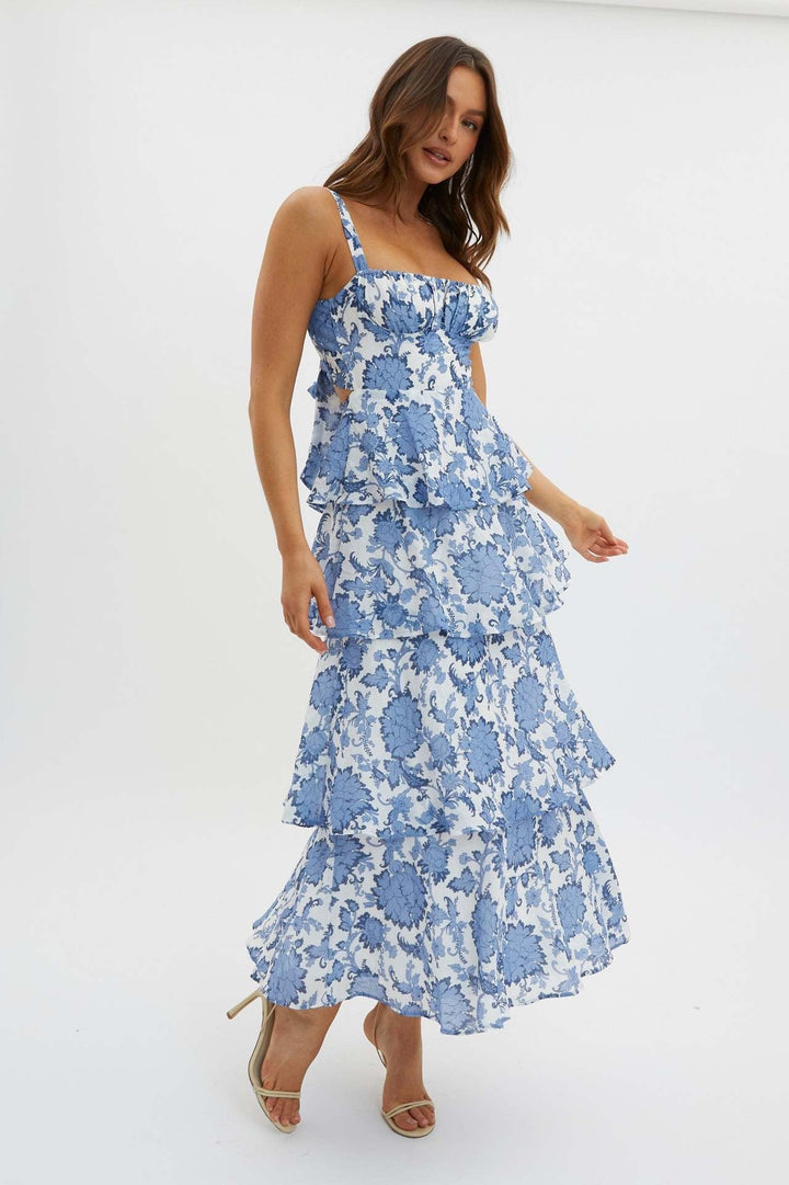Versatile women's floral midi dress with ruffled hem, suitable for casual or elegant party wear.