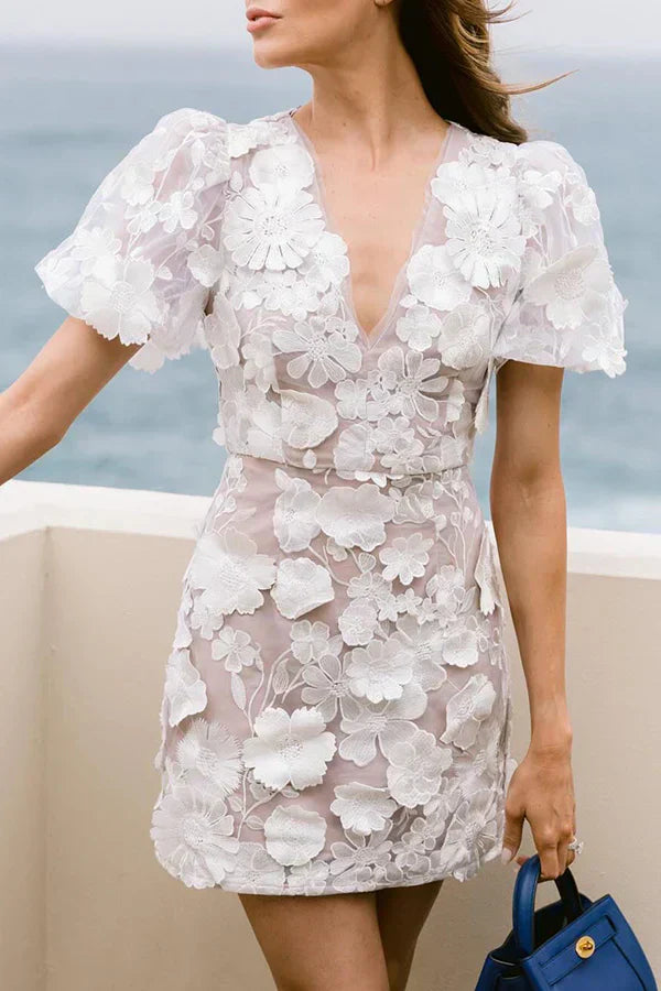 Stylish pastel floral mini dress for women. Short sleeve, flattering fit for spring & summer. New arrival, chic style.