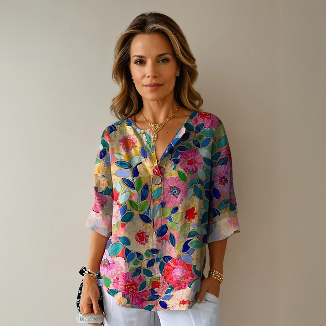 Elegant women's floral print blouse. Chic long-sleeve top perfect for spring and summer fashion.