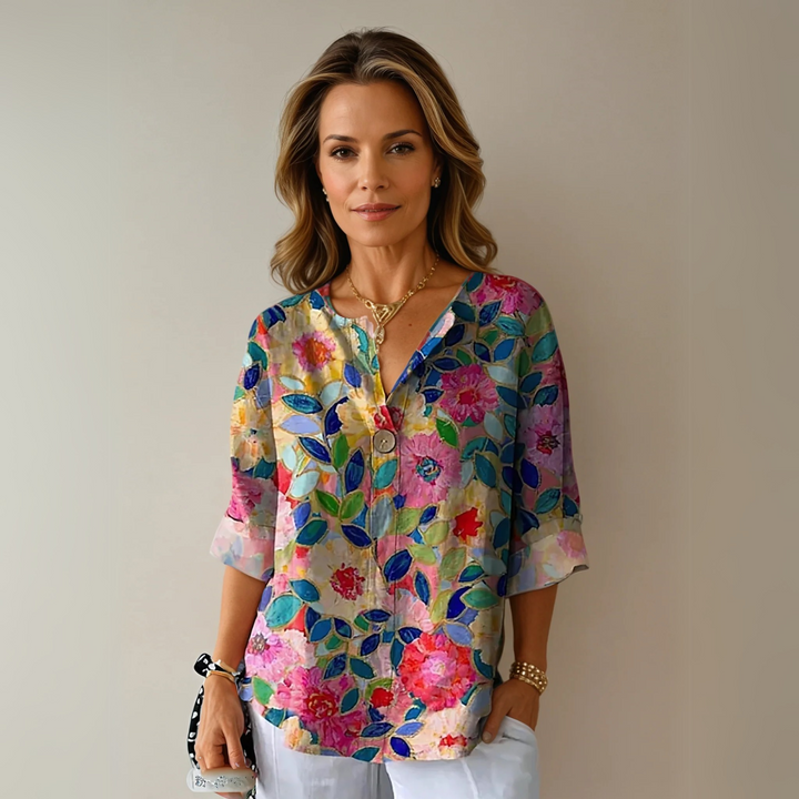 Elegant women's floral print blouse. Chic long-sleeve top perfect for spring and summer fashion.