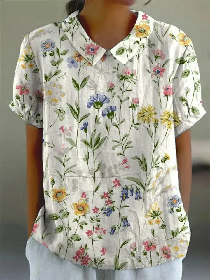 Versatile women's floral blouse for summer, with a stylish Peter Pan collar and breathable fabric.