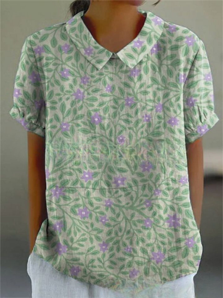 Women's patterned shirt with a feminine floral design and a timeless Peter Pan collar, perfect for daytime.