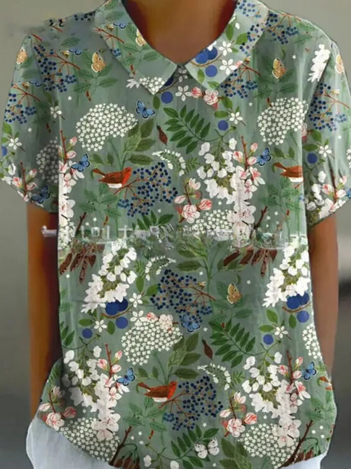 Spring style women's floral print blouse, short sleeves, and a charming Peter Pan collar for an elegant look.