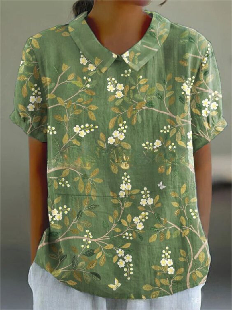 Women's breathable floral blouse, elegant design with a Peter Pan collar and short sleeves, chic apparel.