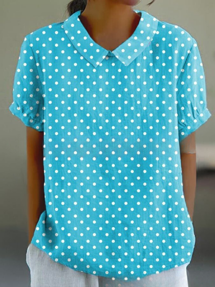 Front view of women's elegant floral blouse with Peter Pan collar, a versatile top for spring and summer.