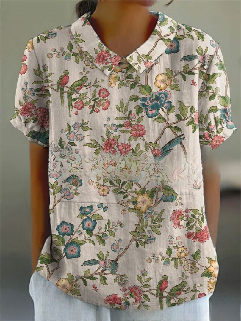 Women's casual floral blouse with a delicate Peter Pan collar and comfortable short sleeves.