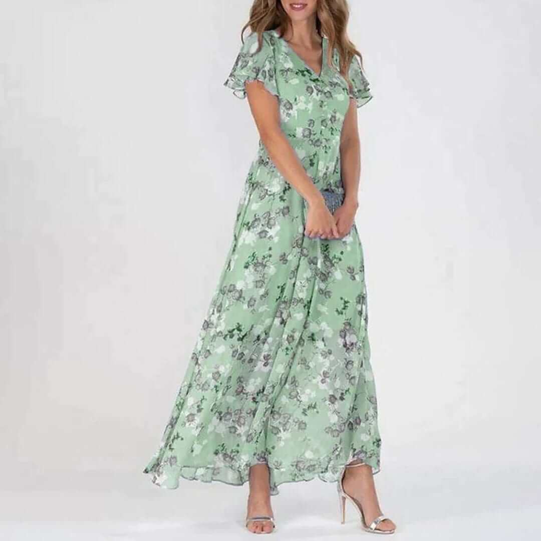 Flowy elegant women's maxi dress with a vibrant floral print and V-neck. A chic choice for summer occasions.