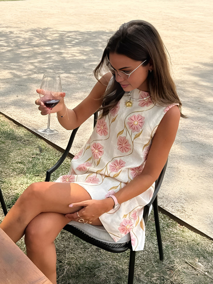 Lightweight women's summer floral mini dress, sleeveless design for comfortable vacation or party wear.