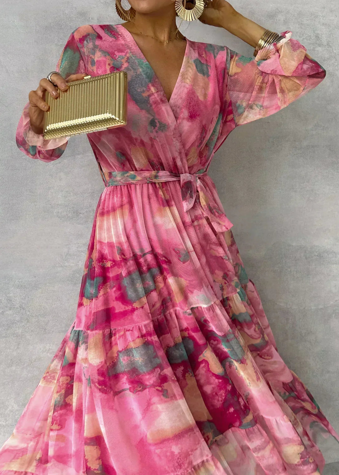 Vibrant pink floral print wrap maxi dress for women. Stylish long sleeve dress, perfect for spring fashion & events.