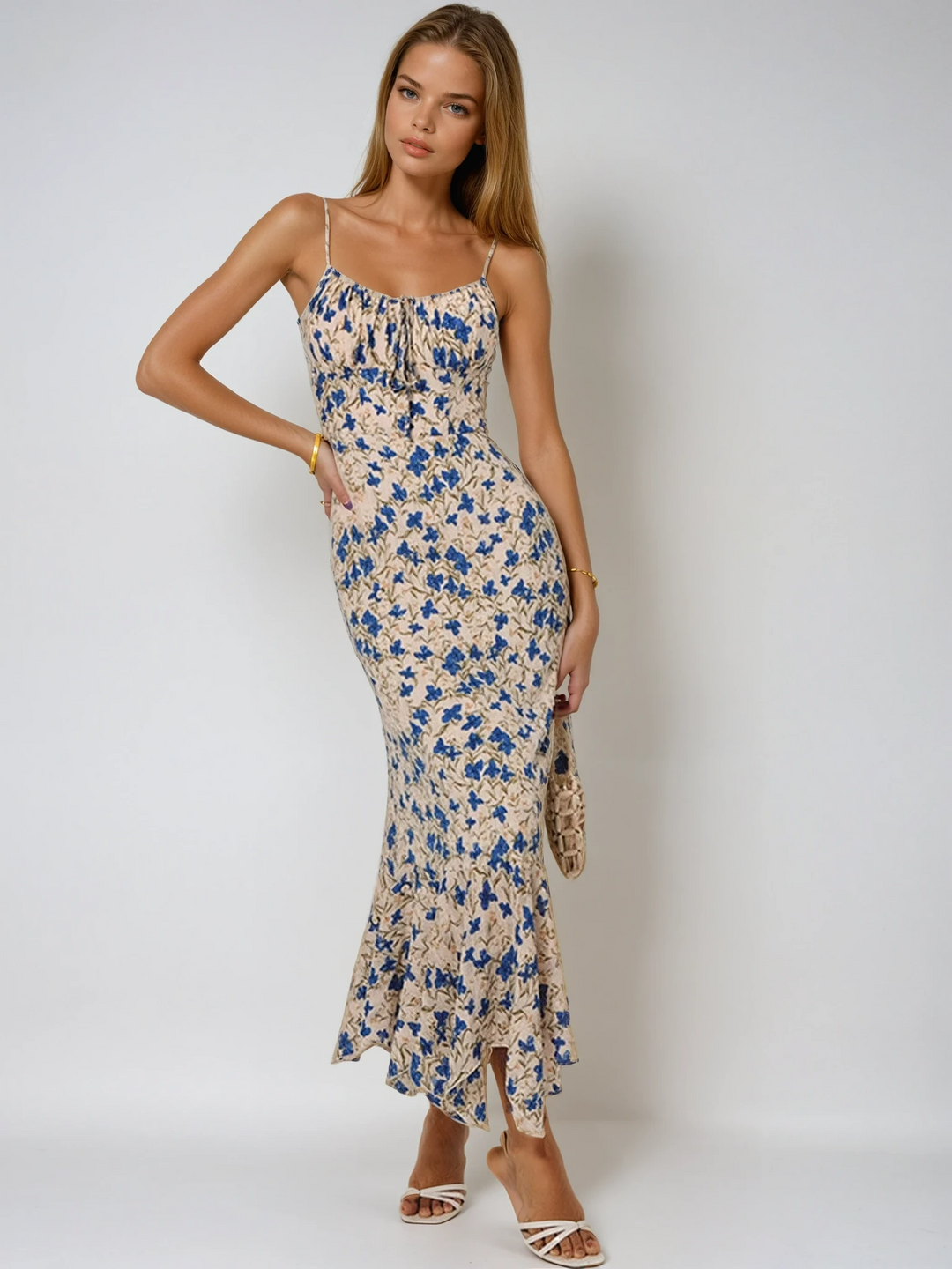 Elegant women's floral ruched maxi dress with spaghetti straps, perfect for summer evenings or beach events.