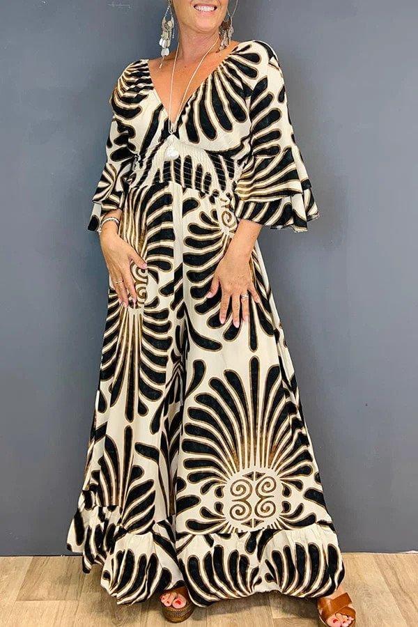 Chic black floral ruffled jumpsuit for women, versatile and comfortable summer fashion. One-piece elegance.