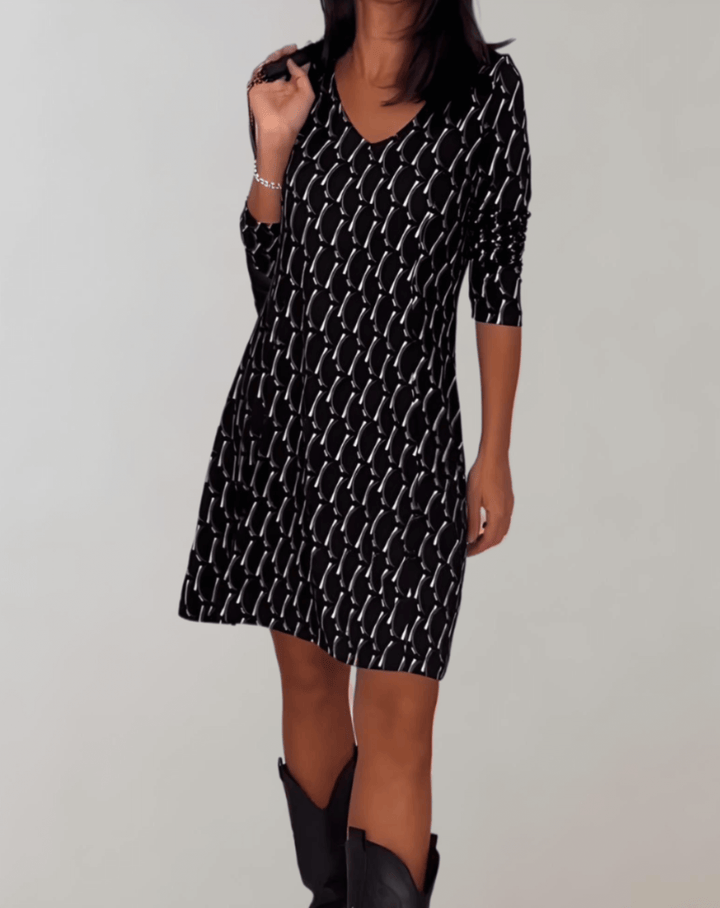 Elegant women's floral summer midi dress with vibrant pattern, perfect for vacation or special occasions.