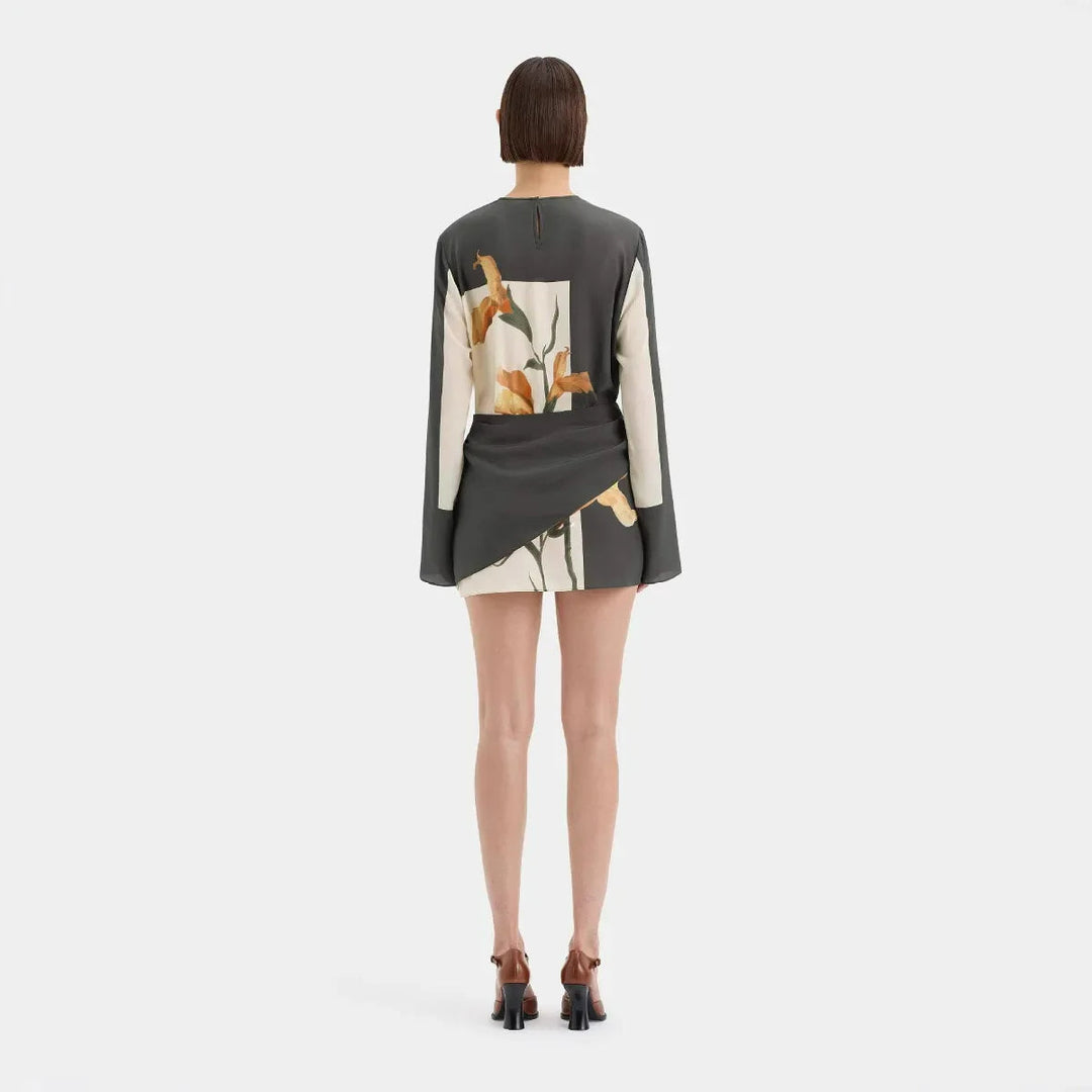 Gorgeous women's floral twist mini dress, an elegant short cocktail dress for a fashionable party look.