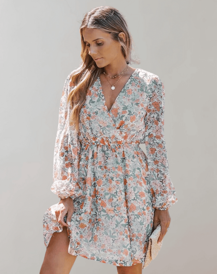 Elegant women's floral V-neck midi dress, perfect for spring parties or summer occasions.