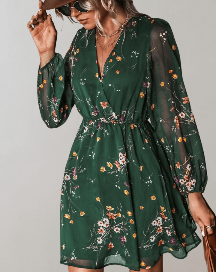 Women's V-neck midi dress with vibrant floral print, elegant and versatile for spring & summer wear.