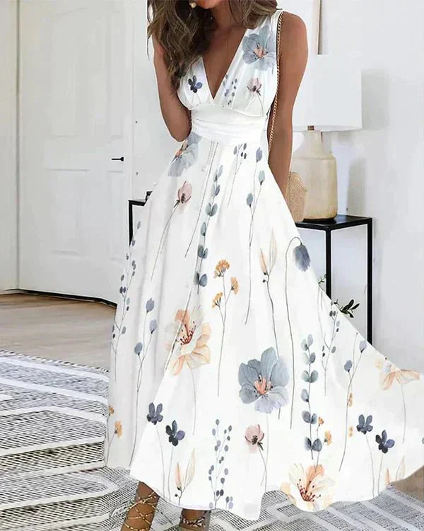 Elegant women's floral V-neck midi dress, sleeveless & flowy, perfect for chic spring & summer daywear or parties.