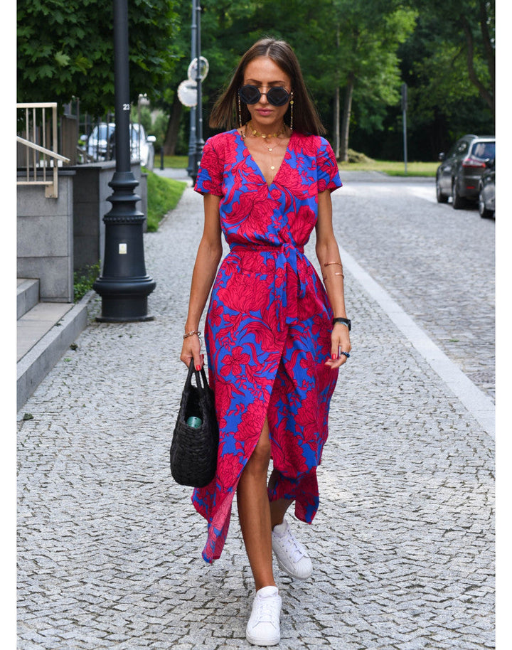 Pink floral V-neck midi wrap dress for women. Feminine summer style, ideal for casual or elegant events.