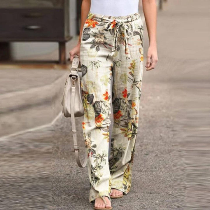 Elegant women's flowerprint casual pants with bow, perfect for summer fashion or a vacation outfit.