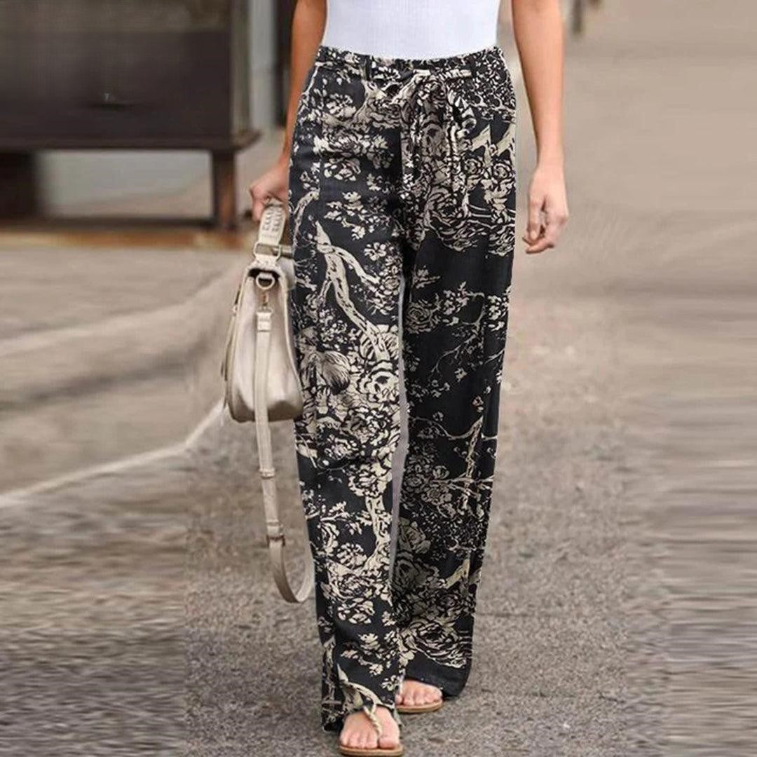 Comfortable women's floral print pants with a chic bow detail, ideal for casual wear and summer style.