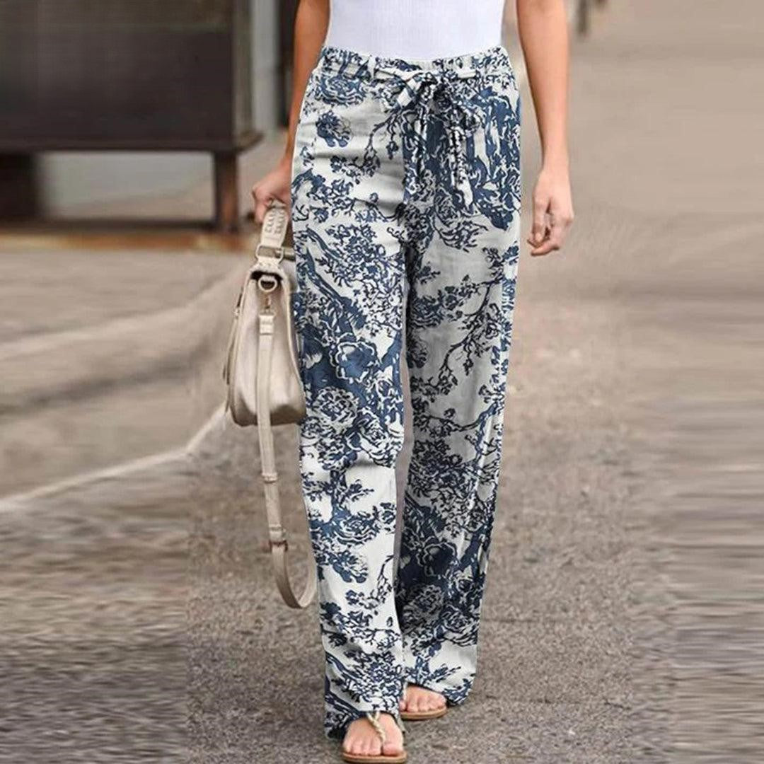 Women's flowerprint pants with bow detail, versatile for elegant casual wear, summer fashion, or vacation.