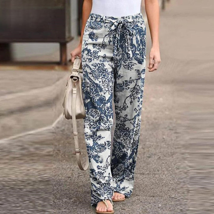 Women's flowerprint pants with bow detail, versatile for elegant casual wear, summer fashion, or vacation.