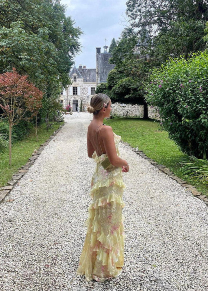 Women's floral print maxi dress with spaghetti straps & ruffles, ideal for summer occasions.