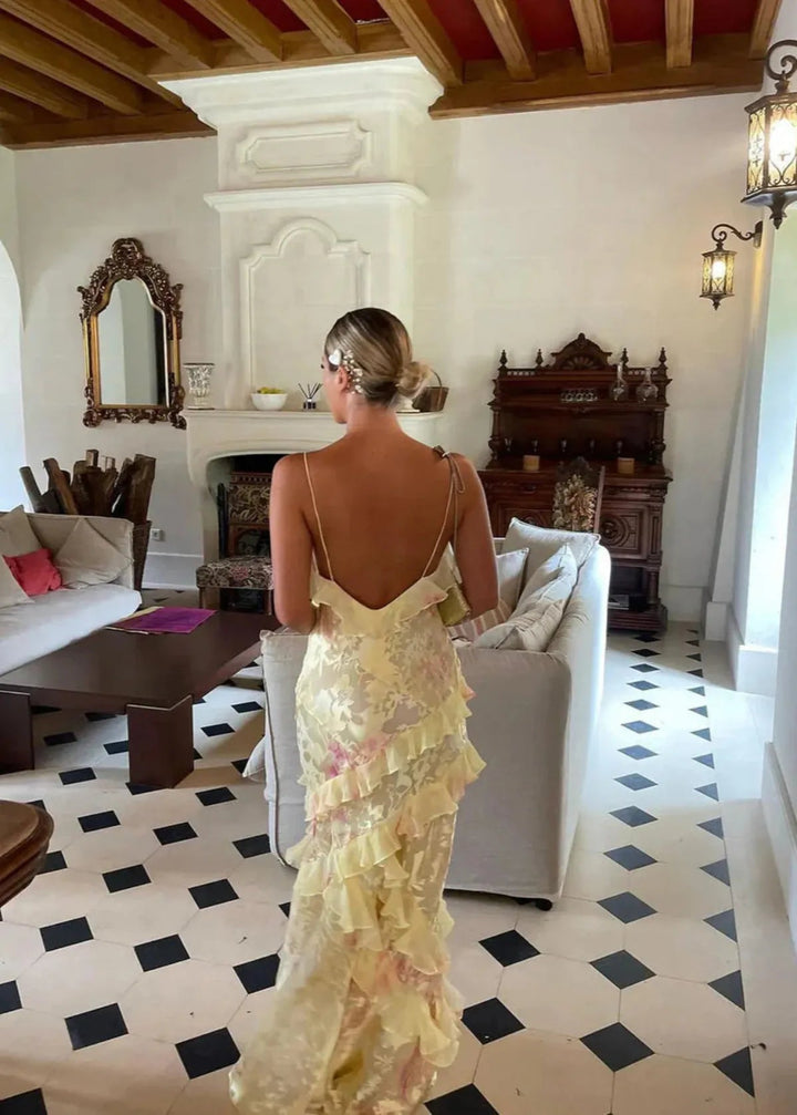 Stylish women's summer maxi dress with vibrant floral print, perfect for elegant events.