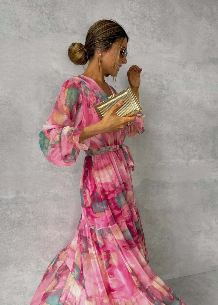 Pink flowy long sleeve casual dress for women. Versatile and comfortable, ideal for effortless summer style.
