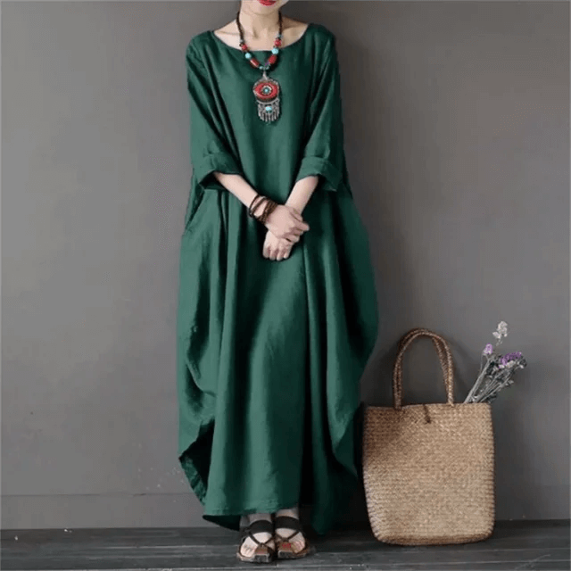 Elegant women's flowy maxi dress, perfect for evening wear or chic summer style, made with comfortable polyester-cotton.