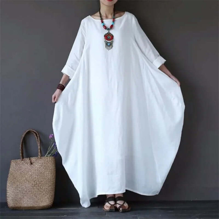 Soft polyester-cotton blend flowy maxi dress for women, offering comfortable and elegant wear all day long.