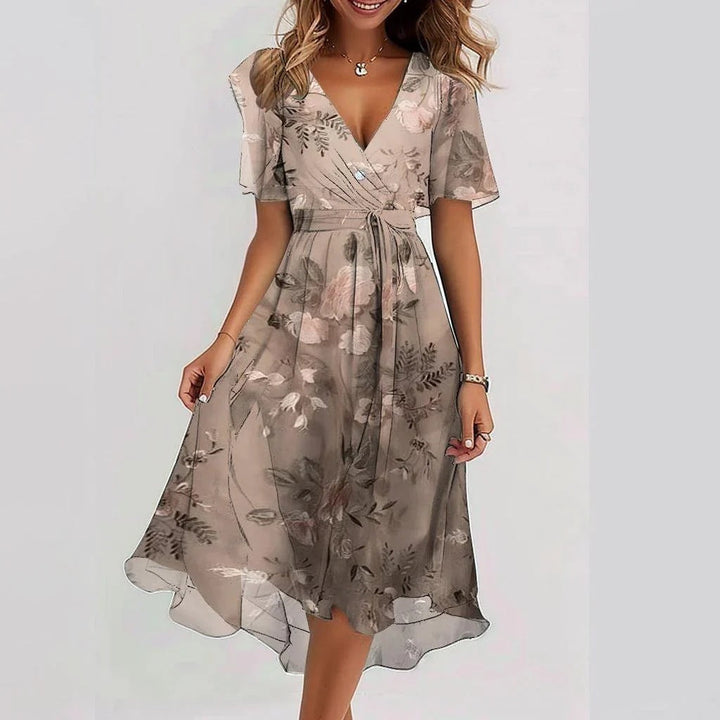 Versatile women's flowy midi summer dress, offering elegant comfort and breezy style for any casual or vacation outing.