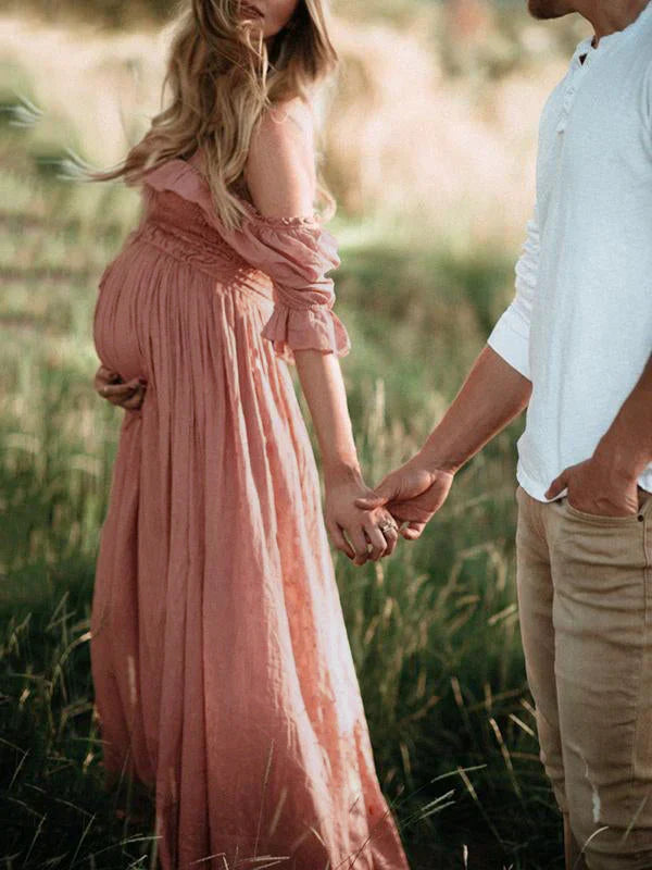 Elegant women's flowy off-shoulder maxi maternity dress, perfect for summer pregnancy fashion and special occasions.